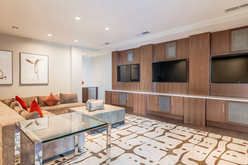 a living room with a couch and a glass table